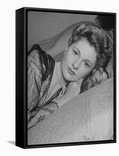 Actress Joan Fontaine Wearing Sheer Negligee While Lounging on Bed at Home-Bob Landry-Framed Stretched Canvas