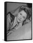 Actress Joan Fontaine Wearing Sheer Negligee While Lounging on Bed at Home-Bob Landry-Framed Stretched Canvas