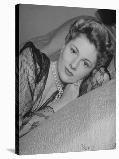 Actress Joan Fontaine Wearing Sheer Negligee While Lounging on Bed at Home-Bob Landry-Stretched Canvas