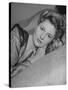 Actress Joan Fontaine Wearing Sheer Negligee While Lounging on Bed at Home-Bob Landry-Stretched Canvas