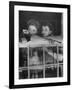 Actress Joan Fontaine with Actress Sister Olivia de Havilland Looking Out of Open Window at Home-Bob Landry-Framed Premium Photographic Print