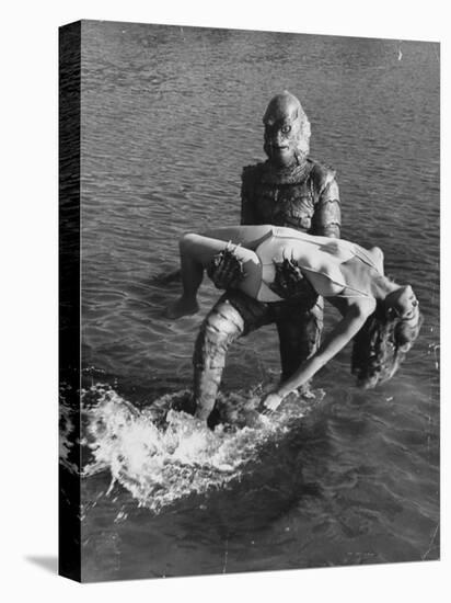 Actress Julia Adams is Carried by Monster, Gill Man, in the Movie, Creature from the Black Lagoon-Ed Clark-Stretched Canvas