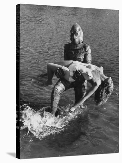 Actress Julia Adams is Carried by Monster, Gill Man, in the Movie, Creature from the Black Lagoon-Ed Clark-Stretched Canvas