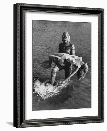 Actress Julia Adams is Carried by Monster, Gill Man, in the Movie, Creature from the Black Lagoon-Ed Clark-Framed Premium Photographic Print