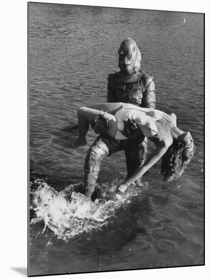 Actress Julia Adams is Carried by Monster, Gill Man, in the Movie, Creature from the Black Lagoon-Ed Clark-Mounted Premium Photographic Print