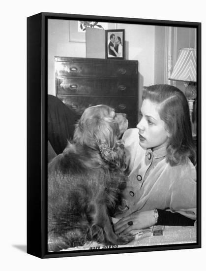 Actress Lauren Bacall Chatting with Her Cocker Spaniel Dog in Her Suite at Gotham Hotel-Nina Leen-Framed Stretched Canvas