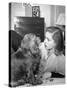 Actress Lauren Bacall Chatting with Her Cocker Spaniel Dog in Her Suite at Gotham Hotel-Nina Leen-Stretched Canvas