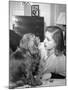 Actress Lauren Bacall Chatting with Her Cocker Spaniel Dog in Her Suite at Gotham Hotel-Nina Leen-Mounted Premium Photographic Print