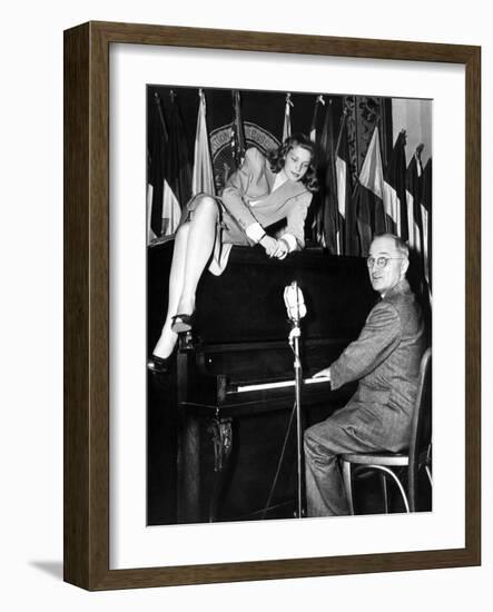 Actress Lauren Bacall Sits Atop the Piano While Vice President Harry Truman Plays-null-Framed Photo