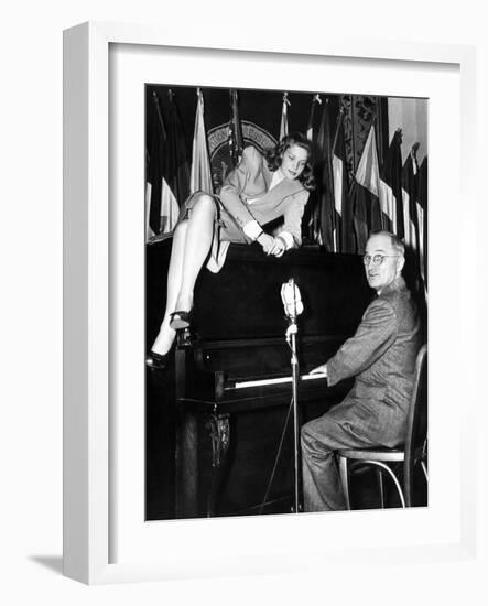 Actress Lauren Bacall Sits Atop the Piano While Vice President Harry Truman Plays-null-Framed Photo