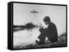 Actress Mia Farrow Pensively Sitting on Rocky Shore of Lake Geneva as Passenger Boat Passes By-Bill Eppridge-Framed Stretched Canvas