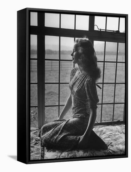 Actress Peggy Cummins Looking Out of a Window-Bob Landry-Framed Stretched Canvas