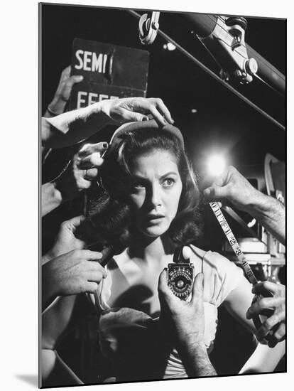 Actress Pier Angeli, Surrounded by Hands From Hair Stylist, Dresser, and Cameraman on MGM Movie Set-Allan Grant-Mounted Premium Photographic Print