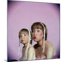 Actress Shirley MacLaine and Daughter Sachi Parker Pouting with String of Pearls on Their Heads-Allan Grant-Mounted Premium Photographic Print