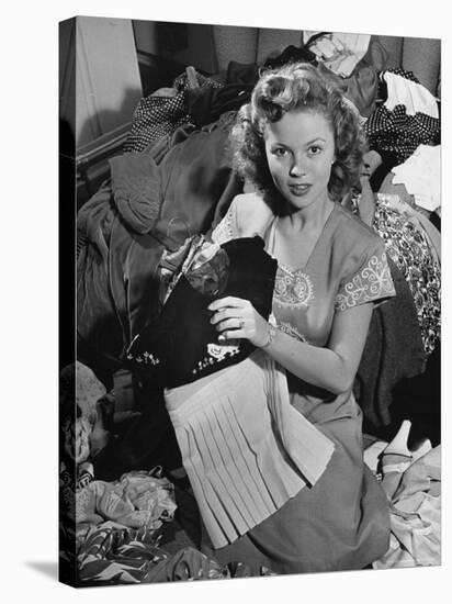 Actress Shirley Temple, Gathering Her Unwanted Clothes Together to Donate to a Clothing Drive-Martha Holmes-Stretched Canvas