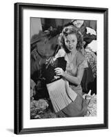 Actress Shirley Temple, Gathering Her Unwanted Clothes Together to Donate to a Clothing Drive-Martha Holmes-Framed Premium Photographic Print