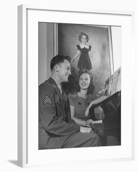 Actress Shirley Temple, Sitting at the Piano with Sgt. John Agar-null-Framed Photographic Print