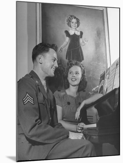 Actress Shirley Temple, Sitting at the Piano with Sgt. John Agar-null-Mounted Photographic Print