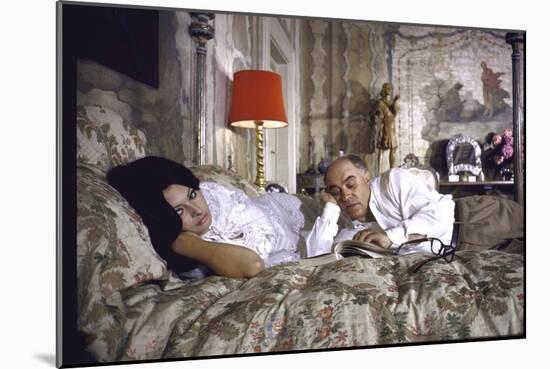 Actress Sophia Loren and Husband Carlo Ponti Lying Across a Bed Together-Alfred Eisenstaedt-Mounted Photographic Print