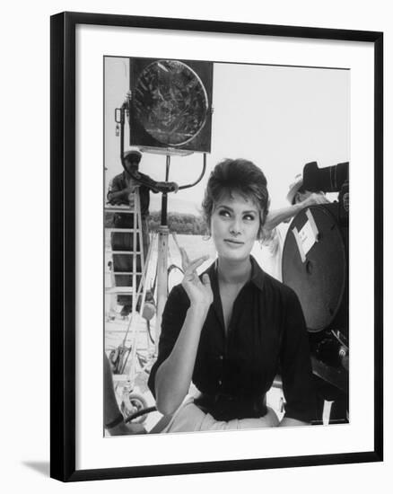 Actress Sophia Loren Crossing Fingers for Good Luck Between Takes on Movie Set-Alfred Eisenstaedt-Framed Premium Photographic Print
