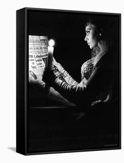 Actress Sophia Loren Reading Newspaper by Candlelight While in Costume for "Madame Sans Gene"-Alfred Eisenstaedt-Framed Stretched Canvas