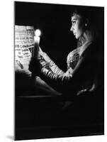 Actress Sophia Loren Reading Newspaper by Candlelight While in Costume for "Madame Sans Gene"-Alfred Eisenstaedt-Mounted Premium Photographic Print