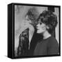 Actress, Tammy Grimes, Posing in Front of Portrait by Rene Bouche-Dmitri Kessel-Framed Stretched Canvas