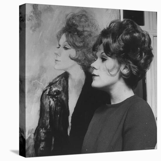 Actress, Tammy Grimes, Posing in Front of Portrait by Rene Bouche-Dmitri Kessel-Stretched Canvas