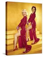 Actresses Marilyn Monroe and Jane Russell Wearing Gowns Designed by Travilla Pose for Publicity-Ed Clark-Stretched Canvas