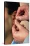 Acupuncturist's Hands Insert Needle Into Man's Ear-Damien Lovegrove-Stretched Canvas