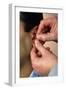 Acupuncturist's Hands Insert Needle Into Man's Ear-Damien Lovegrove-Framed Photographic Print