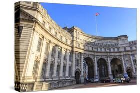 Admiralty Arch with traffic leaving The Mall and Union Flag flying, late autumn sun, London, Englan-Eleanor Scriven-Stretched Canvas