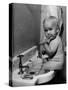 Adorable Baby Brushing Teeth While Sitting in Sink-null-Stretched Canvas