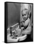 Adorable Baby Brushing Teeth While Sitting in Sink-null-Framed Stretched Canvas