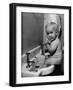 Adorable Baby Brushing Teeth While Sitting in Sink-null-Framed Photographic Print