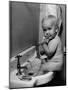 Adorable Baby Brushing Teeth While Sitting in Sink-null-Mounted Photographic Print