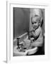 Adorable Baby Brushing Teeth While Sitting in Sink-null-Framed Photographic Print