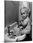 Adorable Baby Brushing Teeth While Sitting in Sink-null-Mounted Photographic Print