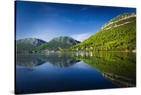 Adriatic reflection and the Great Wall above the city center, Ston, Dalmatian Coast, Croatia-Russ Bishop-Stretched Canvas