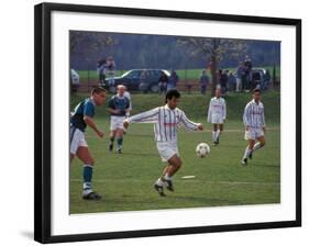 Adults playing soccer, Germany-Alan Klehr-Framed Photographic Print