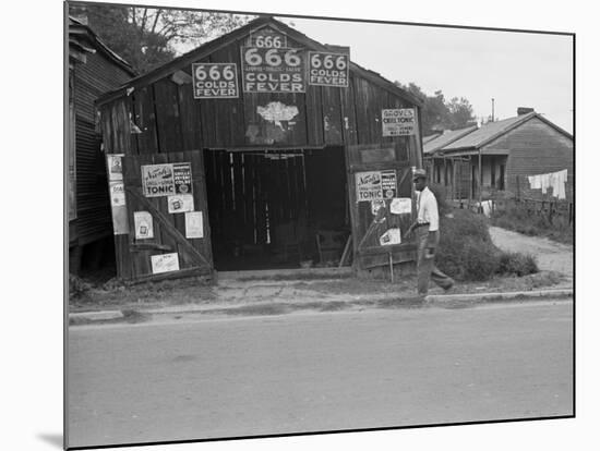 Advertisements for Popular Malaria Cure, Natchez, Mississippi, c.1935-Ben Shahn-Mounted Photo