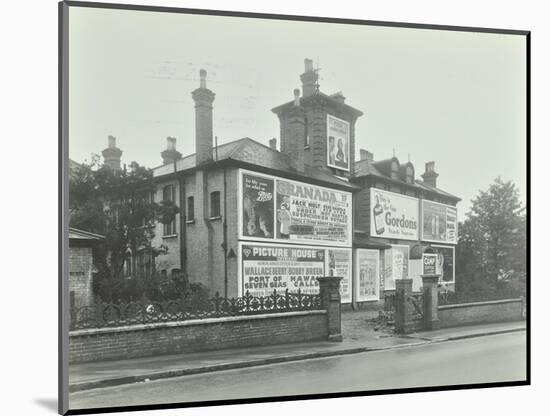 Advertising Hoardings on the Wall of a Building, Wandsworth, London, 1938-null-Mounted Photographic Print