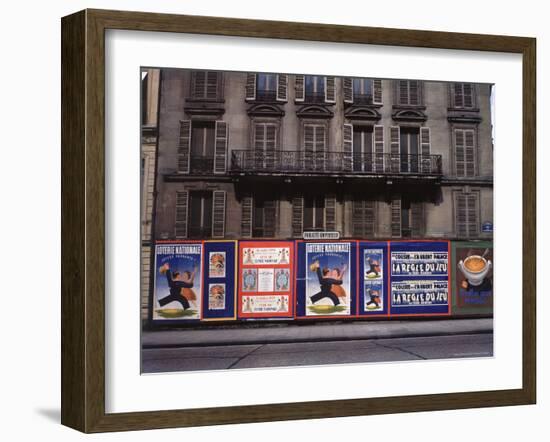 Advertising Posters Plastered on a Wall Along the Rue de Courcelles-William Vandivert-Framed Photographic Print