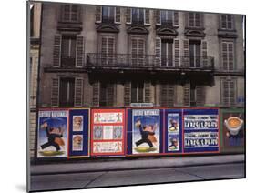 Advertising Posters Plastered on a Wall Along the Rue de Courcelles-William Vandivert-Mounted Photographic Print