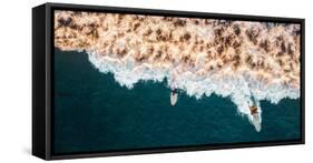 Aerial drone photo of surfers riding Pacific Ocean waves in San Diego, California at Sunset Cliffs-David Chang-Framed Stretched Canvas