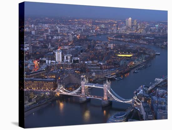 Aerial Photo Showing Tower Bridge, River Thames and Canary Wharf at Dusk, London, England-Charles Bowman-Stretched Canvas