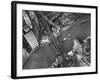 Aerial View of a Bridge Crossing a River Flowing Through the City-Margaret Bourke-White-Framed Photographic Print