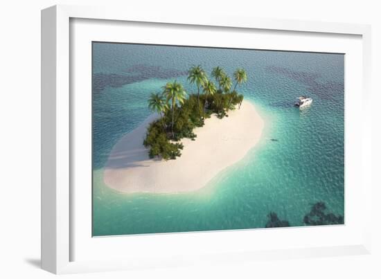 Aerial View of a Caribbean Desert Island in a Turquoise Water with a Woman Diving and a Yacht as a-Pablo Scapinachis-Framed Art Print