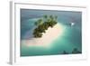 Aerial View of a Caribbean Desert Island in a Turquoise Water with a Woman Diving and a Yacht as a-Pablo Scapinachis-Framed Art Print