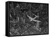 Aerial View of a DC-4 Passenger Plane Flying over Midtown Manhattan-Margaret Bourke-White-Framed Stretched Canvas